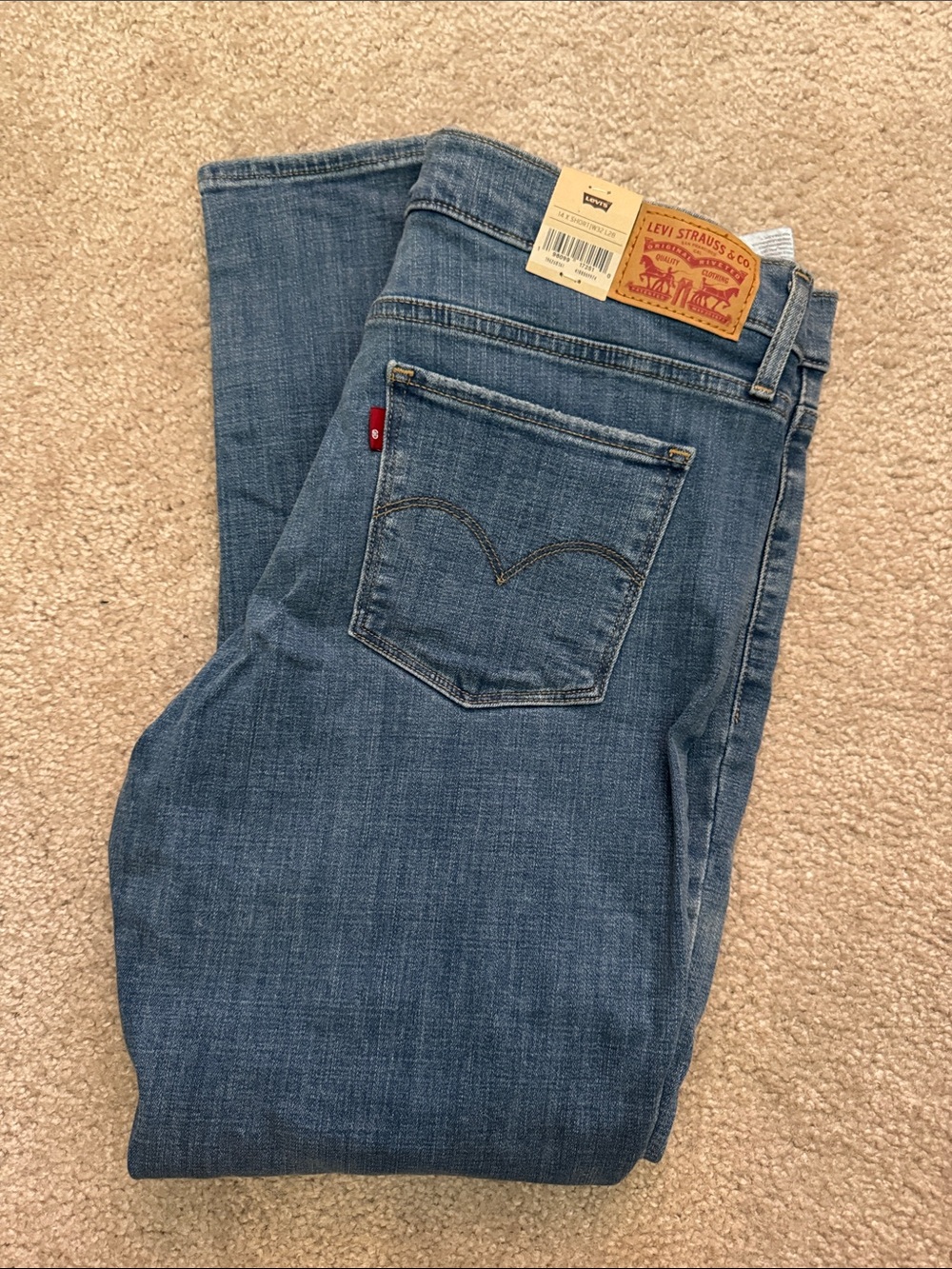 Levi's Straight Jeans in Medium Blue Denim with Red Tab